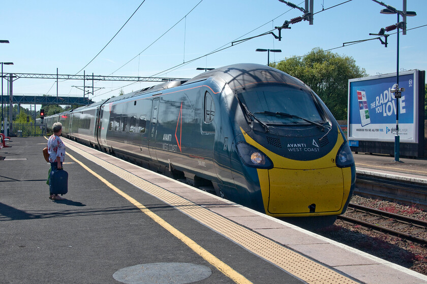 390002, 09.43 London Euston-Preston (9P55, 9L), Birmingham International station 
 390002 'Stephen Sutton' arrives at Birmingham International working the 09.43 Euston to Preston service. Mike and I took this Pendolino service to Crewe taking the longer and slower route via New Street rather than the Trent Valley however, this was what split ticketing had deemed was the cheapest way to make the journey. The Avanti West Coast service was very busy as are many of what used to be regarded as 'off-peak' services with commuter trains much quieter as a result of the changing dynamic of train travel post-COVID something that will need to be addressed unless there is a wait to see if the previous travelling patterns will return and prevail. 
 Keywords: 390002 09.43 London Euston-Preston 9P55 Birmingham International station Stephen Sutton