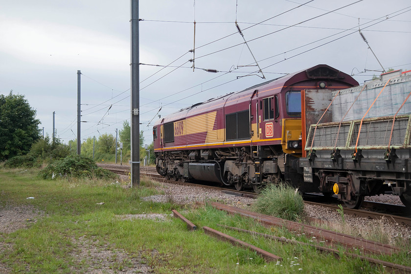 66109, 05.47 Peterborough West Yard-Bow Depot (6L69), Arlesey footbridge 
 66109 heads south on the up slow at Arlesey with the 6L49 05.47 Peterborough West Yard to Bow engineers' train. I know that it's a 'going-away' shot but we had been tracking the progress of this working and all of a sudden it disappeared off RTT. So, we started walking away and then off course it arrived ! Nonetheless, a shot taken through the palisade fencing at Arlesey is not too bad 
 Keywords: 66109 05.47 Peterborough West Yard-Bow Depot 6L69 Arlesey footbridge