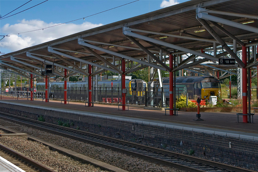 350102 & 57309, stabled, Rugby station 
 In time past many trains terminated and originated from Rugby station. Today no services use the south-facing bay platforms with the north-facing ones having completely disappeared during the recent re-modelling of the station. However, as can be seen in this image, they are still used for stabling. In this case, 350102 rests between duties keeping company with WCML Thunderbird 57307 'Pride of Crewe' sits basking in the summer sunshine. 
 Keywords: 350102 57309 stabled Thunderbird Rugby station Pride of Crewe London Midland Desiro