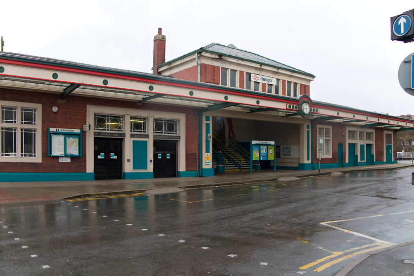 Frontage, Bangor station 
 The frontage of Bangor station that faces Deiniol Road. This building was constructed by the LMS between 1924 and 1927 when the station was expanded with an additional platform created behind this new building. Considerable work has been done to renovate this building, and the rest of the station, with the whole place having a pleasant atmosphere. 
 Keywords: Frontage Bangor station