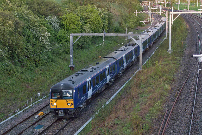 360106 & 360108, 18.30 Cricklewood Depot-Kettering Sidings (5Z08, 25L), Sharnbrook Road bridge 
 Despite now being branded as 'EMR Connect' the former Greater Anglia Class 360s cannot hide their past given that their livery has remained exactly the same. 360106 and 360108 work the 5Z08 18.30 Crickelwood to Kettering stabling sidings empty coaching stock move. The train is seen on the down slow line at Sharnbrook Road near the Bedfordshire village of Souldrop. Notice the brief burst of evening sunshine in the background that was, unfortunately, too low on the sky to illuminate the subject with just a little light getting through the bridge's arch catching the driver's screen. 
 Keywords: 360106 360108, 18.30 Cricklewood Depot-Kettering Sidings 5Z08 Sharnbrook Road bridge EMR Connect East Midlands Railway Desiro