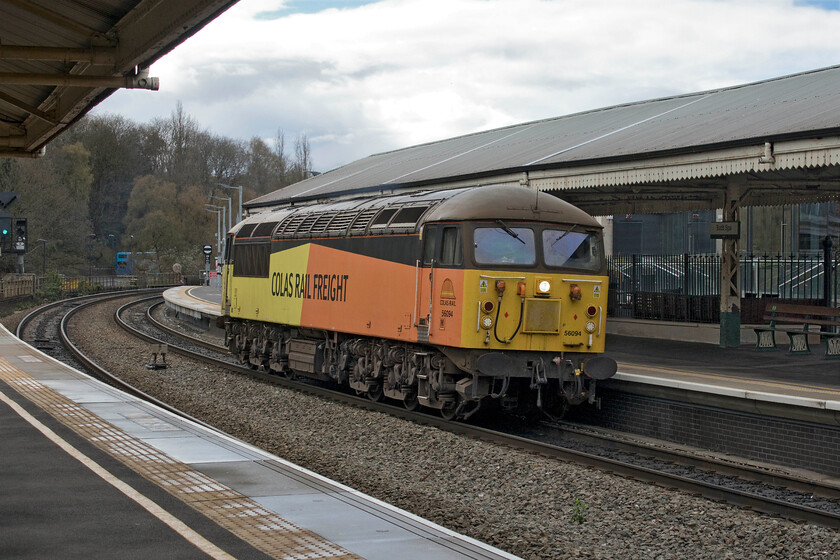 56094, 10.13 Westbury Down TC-Westbury Down TC (via Gloucester & STJ) (1E), Bath Spa station 
 On arrival at Bath Spa 56094 appeared around the curve to the west of the station with turbo unit 166205 leaving and breathing down our backs and about to spoil the scene! I am not at all sure as to the purpose of this almost completely circuitous working out and back to Westbury via Gloucester and a reversal at Severn Tunnel Junction. I also could not identify the working code for the veteran Class 56 that will celebrate its fortieth birthday this August. 
 Keywords: 56094 10.13 Westbury Down TC-Westbury Down TC Gloucester Severn Tunnel Junction Bath Spa station Colas Railfreight