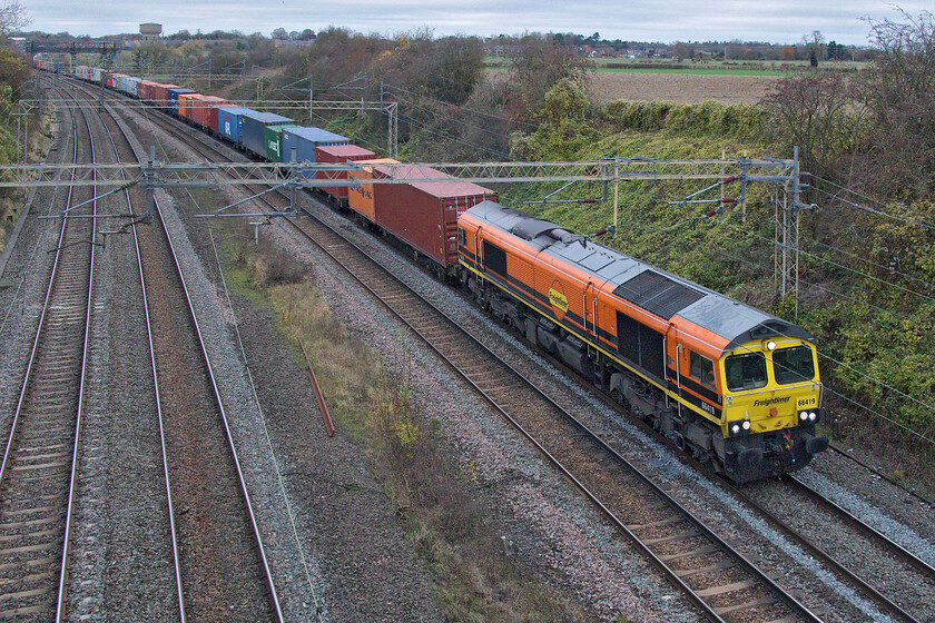 66419, 12.16 Lawley Street-London Gateway (4L46, 4E), Victoria bridge 
 Freight three - 14.26 - the 12.16 Lawley Street to London Gateway 4L46 service passes Victoria bridge led by 66419. With the increasing number of Class 66s being outshopped in the Freightliner version of the Genesee & Wyoming livery, the quality of photographs on days such as this has improved considerably! 
 Keywords: 66419 12.16 Lawley Street-London Gateway 4L46 Victoria bridge Freightliner Genesee & Wyoming