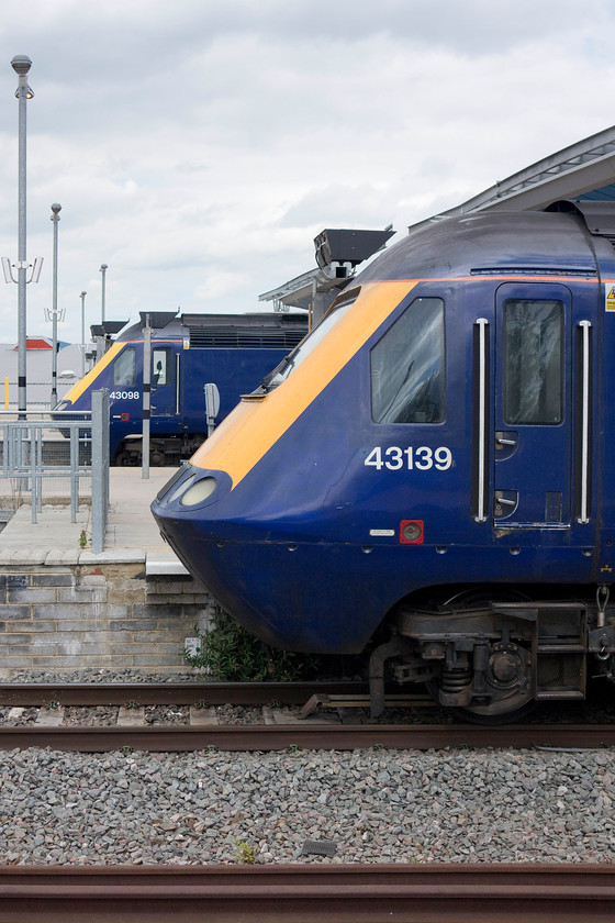 43139, GW 14.00 London Paddington-Bristol Temple Meads (1C17) & 43098, GW 14.01 Oxford-London Paddington (1P49), Reading station 
 Two HST workings pause at Reading that started from their origins stations within a minute of each other. In the foreground, 43139 'Driver Stan Martin 15 June 1950 - 6 Nov 2004' leads the 14.00 Paddington to Bristol Temple Meads. In the background, 43098 sits at the rear of the 14.01 Oxford to Paddington 'fast' working. 
 Keywords: 43139 14.00 London Paddington-Bristol Temple Meads 1C17 43098 14.01 Oxford-London Paddington 1P49 Reading station