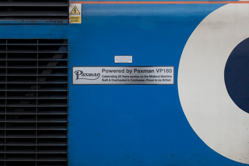 Vinyl, 43047, EM 11.45 Nottingham-London St. Pancras (1B38, 3E), Nottingham station 
 Whilst not strictly a nameplate and not officially named 43047 does carry this commemorative vinyl on its flanks. It states, in the small print, that 43047 was the first power car to receive a replacement Paxman VP185 engine back in 1995 installed at Neville Hill. This power car was the first of a second batch released into service on the Western Region in March 1977 as part of set 253023. In this photograph, the power car is about to leave Nottingham at the rear of the 1B38 11.45 to St. Pancras. 
 Keywords: Vinyl name 43047 EMR 11.45 Nottingham-London St. Pancras 1B38 Nottingham station HST Paxman VP185 East Midlands Railway