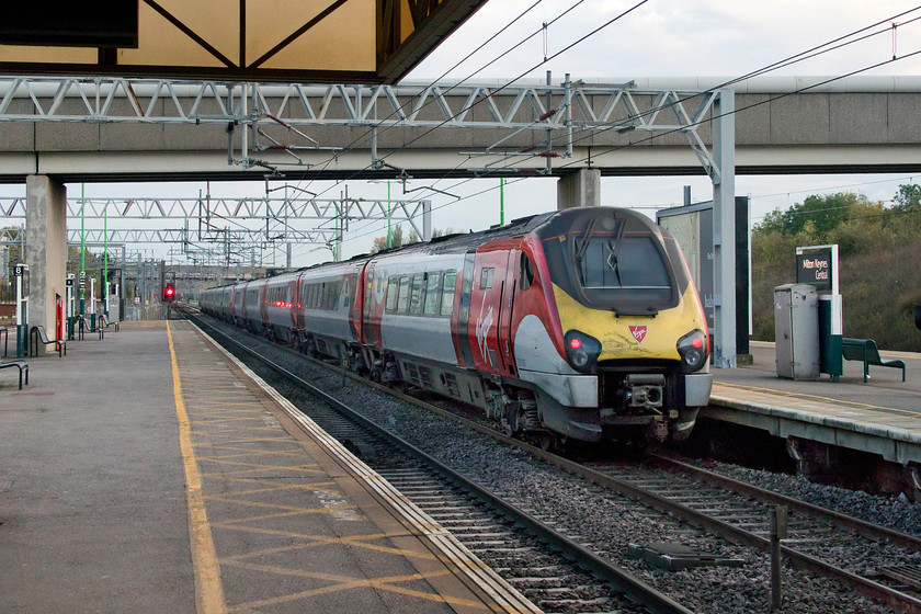 221101, VT 10.52 Glasgow Central-London Euston (9F54, 2L), Milton Keynes Central station 
 I have very few pictures of the flowing silk liveried 221101 '101 Squadron' and with the company about to relinquish its franchise in the next few weeks I have few chances left! Here it is seen at the back of the 10.52 Glasgow Central to Euston as it leaves Milton Keynes Central station in the dying light of an early autumn afternoon. 
 Keywords: 221101 10.52 Glasgow Central-London Euston 9F54 Milton Keynes Central station