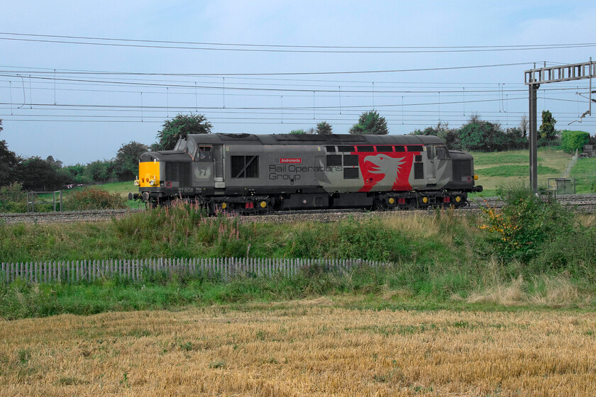 37608, 08.42 Derby RTC-Orient Way CS, terminated at Bletchley (0Z88, 8E), between Roade & Ashton 
 37608 'Andromeda' ambles through the sunny Northamptonshire countryside between Roade and Ashton as the 08.42 Derby RTC to Orient Way light engine move. Unfortunately, for any enthusiasts out on the glorious early autumn day much further south they were to be denied a photograph as the move was terminated at Bletchley where it stayed for a few hours before returning north later in the day. It was destined to go to the new Orient Way depot adjacent to Spitalfields Market in east London but obviously, the situation changed hence its hefty layover some ten miles south of this location. 
 Keywords: 37608 08.42 Derby RTC-Orient Way CS Bletchley 0Z88 between Roade & Ashton Andromeda