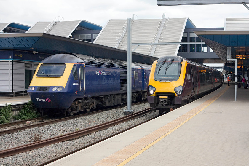 43056, GW 13.45 London Paddington-Swansea (1B40), & 220019, XC 12.45 Bournmouth-Manchester Piccadilly (1M50), Reading station 
 43056 has just arrived at platform eight with the 13.45 Paddington to Swansea service. Meanwhile, next to it on platform seven, 220019 is waiting with the 12.45 Bournemouth to Manchester Piccadilly. The Voyager will have arrived a few minutes earlier with the crew then changing ends for its reversal back out and onwards towards Didcot and Oxford. 
 Keywords: 43056 13.45 London Paddington-Swansea 1B40 220019 12.45 Bournmouth-Manchester Piccadilly 1M50 Reading station