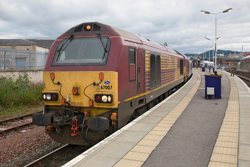 67007 & 67009, CS 20.44 Inverness, Aberdeen & Fort William-London Euston sleeper (1M16), Inverness station 
 The evening's up Highland Sleeper waits at Inverness station. It will leave at 20.44 joining portions from Fort William and Aberdeen at Edinburgh Waverley in the 'wee small hours'! The sleeper is headed by two EWS locomotives, 67007 and 67009. Notice the subtle Saltire attached to the front of 67007 just above the number. 
 Keywords: 67007 67009 20.44 Inverness Aberdeen Fort William-London Euston sleeper 1M16 Inverness station Caledonian Sleeper Mk. 3 III stock Highland Sleeper