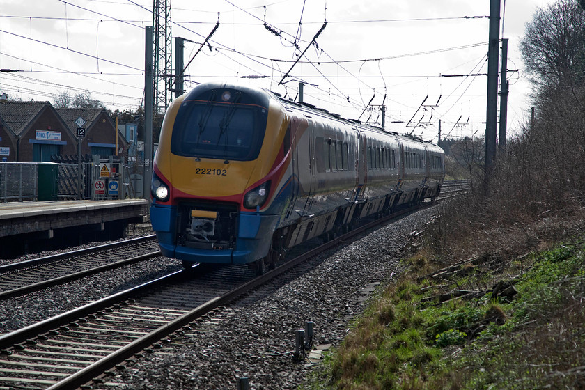 222102, EM 10.25 Nottingham-London St. Pancras (1D24, 6L), Flitwick Station 
 Breaking the rules by looking into the light, four-car 222102 passes Flitwick station with the 1D24 10.25 London St. Pancras to Nottingham. Whilst these types of shots are frowned at by the traditionalist photographer, with judicious use of post-processing (Photoshop) a reasonable and 'different' shot can be presented as here.....comments please! 
 Keywords: 222102 1D24 Flitwick Station