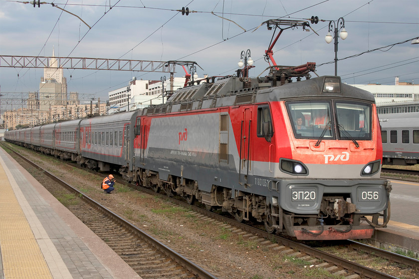 EP20-056, 17.17 Moscow Kiyevsky-Bryansk (107), Moscow Kiyevsky station 
 The 17.17 Moscow Kiyevsky to Bryansk train makes ready to depart from Moscow illuminated by a hint of the early evening sun. It is being led by one of the relatively new two hundred Olympus locomotives, EP20-056. These Bo-Bo-Bo locos. are being built at the Transmashholding's Novocherkassk Electric Locomotive Plant as a joint effort between them and Alstom who now have a 25% stake in the company. This service is composed of traditional RZD stock permitting a roomy and comfortable journey for its passengers making the 235-mile journey to Bryansk, and industrial town of some 400000 people south-west of Moscow. 
 Keywords: EP20-056 17.17 Moscow Kiyevsky-Bryansk 107 Moscow Kiyevsky station