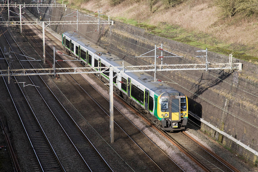 350374, LM 11.33 Birmingham New Street-London Euston (1W12), Roade Cutting 
 The sun has fully com out just in time to illuminate 350374 passing through Roade cutting working the 11.38 Birmingham New Street to London Euston. 
 Keywords: 350374 11.33 Birmingham New Street-London Euston 1W12 Roade Cutting