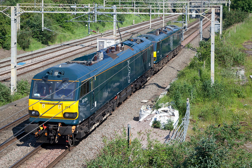 92014 & 92033, 07.30 Crewe-Willesden LEs (0A92), site of Roade station 
 92014 and 92033 look very smart in their new Caledonian Sleeper teal livery. They are seen running as a pair of light engines as the 0A82 07.30 Crewe to Willesden light engine move pas the site of Roade station. 
 Keywords: 92014 92033 07.30 Crewe-Willesden 0A92 site of Roade station