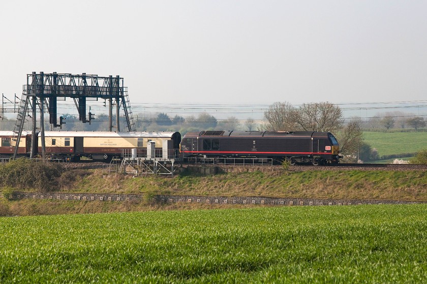 67006, 08.14 London Victoria-Runcorn (1Z39), between Roade & Ashton 
 67006 'Royal Sovereign' leads the 08.14 London Victoria to Runcorn Belmond British Pullman special conveying race goers for the Aintree Grand National. It is seen passing the lovely south Northamptonshire countryside near Roade; I would say that though as I leave very close to this spot! 
 Keywords: 67006 08.14 London Victoria-Runcorn 1Z39 between Roade & Ashton