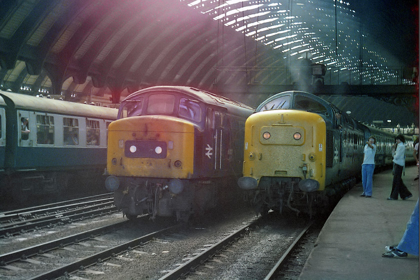 Class 46 & class 55, unidentified down working, York station 
 A typically busy scene at York station. A rake of Mk. I stock sits on the present-day platform three. A class 45 waits on one of the centre roads that have now been removed. Most of the action centres around an unidentified Deltic heading north on the presently numbered platform five. There looks to be quite an animated conversation taking place between the driver of the Deltic and a chap (along with some others) wearing some period flared jeans! Who would have thought that forty-four years later I would be standing on the same spot photographing a Deltic again, see... https://www.ontheupfast.com/p/21936chg/30044658340/x9-t-55009-55013-outward-leg-coronation 
 Keywords: Class 46 class 55 unidentified down working York station