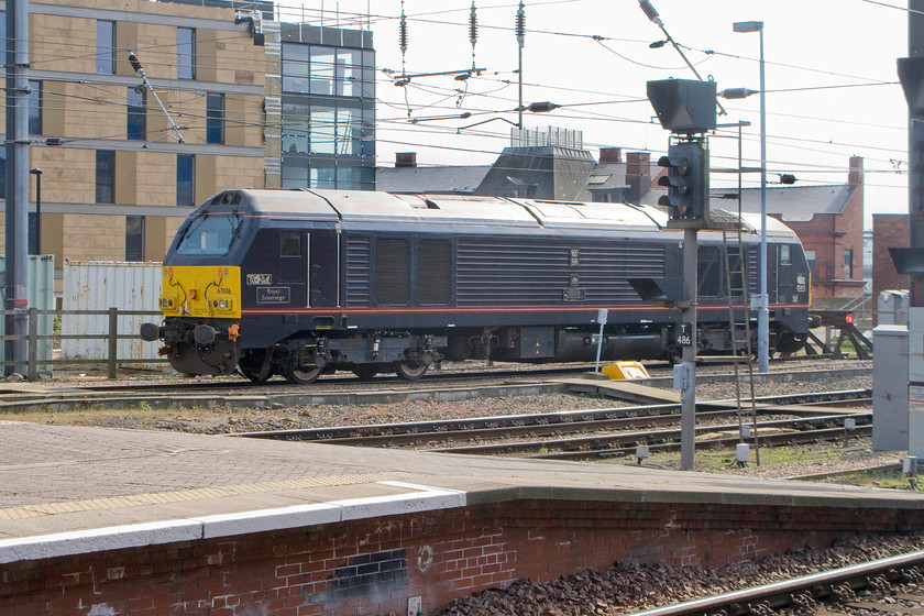 67006, stabled thunderbird, Newcastle station 
 67006 'Royal Sovereign' is seen stabled at the western end of Newcastle Central station. Whereas the WCML uses class 57s as its thunderbird rescue locomotives, the ECML utilises class 67 that are stabled at various strategic locations up and down the line between King's Cross to Edinburgh. 
 Keywords: 67006 stabled thunderbird, Newcastle station Royal Soveriegn