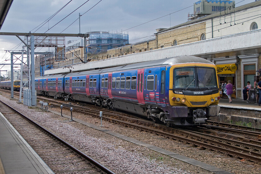 365513, FC 14.44 London King's Cross-King's Lyn (1T32), Cambridge station 
 365513 'Hornsey Depot' leaves Cambridge station working the 14.44 King's Cross to King's Lyn First Capital Connect service. Like the Class 317 units that are also operated by FCC these more modern units dating from the mid-1990s also face an uncertain future as new trains are now on order. It is not at all clear at the moment if they will move to another operator or if the scrap man will be rubbing his hands! 
 Keywords: 365513 14.44 London King's Cross-King's Lyn 1T32 Cambridge station FCC First Capital Connect Hornsey Depot