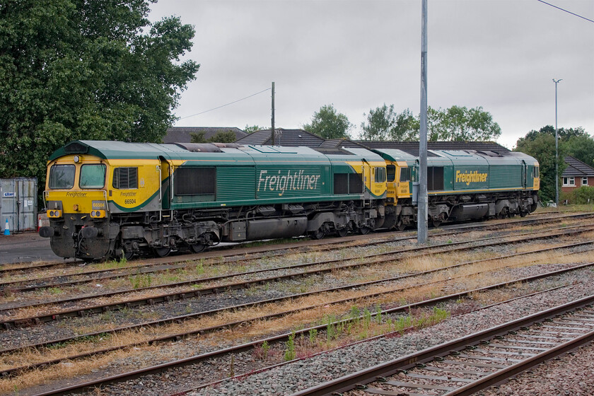 66504 & 66589, stabled, Bristol Parkway 
 Despite the grey skies it had actually stopped raining on arrival at Bristol Parkway. Freightliner's 66504 and 66589 are seen stabled in the sidings adjacent to the station. I have photographed both of these Class 66s close to home on the WCML such is their national operation. The more seasoned enthusiasts all remember the days of copping locomotives such as Class 47, 37 and 31 that were shedded away from our home areas that we would not normally see. 
 Keywords: 66504 66589 stabled Bristol Parkway Freightliner