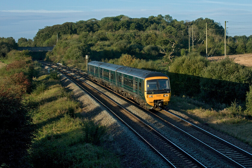 166204, GW 06.42 Weymouth-Filton Abbey Wood (2V71, RT), Berkley ST802494 
 I lovely early morning lighting the 06.42 Weymouth to Filton Abbey Wood GWR service is passing Berkley just to the east of Frome worked by 166204. This is a location that I have visited many times and one that still offers great photographic views in both directions. 
 Keywords: 166204 06.42 Weymouth-Filton Abbey Wood 2V71 Berkley ST80249 GWR Turbo