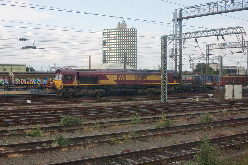 66091, stabled, Wembley yard 
 66091 in Wembley yard at the head of what looks to be some kind of infrastructure train. Taking the Southern service into London makes for a much more sedate journey through Wembley yard rather than the usual dash through on a London Midland train. 
 Keywords: 66091 Wembley yard