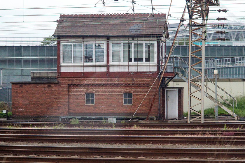 Willesden Carriage Shed North signal box (LMS, 1953) 
 As we were on a slower than usual Southern service we passed through Wembley Yard at a fraction of the speed that we usually do on a London Midland train. This gave an opportunity to photograph a remarkable survivor, Willesden Carriage Shed North signal box. It controls the north end of the extensive yard and was opened by British Railways to an LMS design in 1953. Amazingly, nearly all of the 42-lever frame is still in use. In a sea of advanced cutting edge digital signalling, to find this mechanical piece of machinery still in use doing what it was designed to do seventy years ago is a amazing. 
 Keywords: Willesden Carriage Shed North signal box