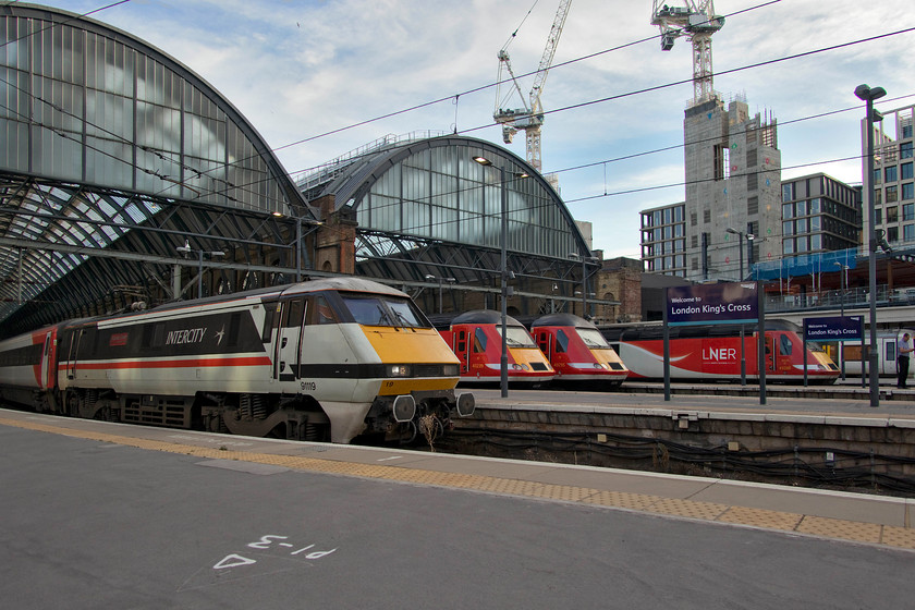 91119, 43339, 43295 & 43208, various workings, London King`s Cross station 
 Azuma anybody? After being introduced over two months previously, the Azumas have made limited inroads into LNER services. During an hour or so at King's Cross on a busy Friday evening, Andy and I observed only one. This more common scene prevailed with a line up of three HSTs (43339, 43295 & 43208) and celebrity 91119 'Bounds Green'. 
 Keywords: 91119 43339 43295 43208 various workings London King`s Cross station