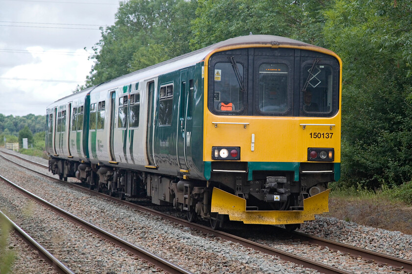 150137, LN 09.45 Bletchley-Bedford (2S09, 1L), Lidlington SP984387 
 Seen a little earlier, 150137 is seen returning as the 09.45 Bletchley to Bedford service. It is passing a foot crossing just southwest of Lidlington station. There are a number of flat crossings within a mile or so in this area something that Network Rail will no doubt be attending to in the next few years. 
 Keywords: 150137 09.45 Bletchley-Bedford 2S09 Lidlington SP984387 London Northwestern