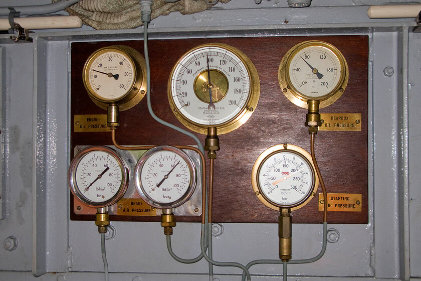 764, cab interior gauges, as part of driver experience session, Pitsford sidings 
 I suspect that number 764, now named 'Sir Gyles Isham', was produced new back in 1948 that its small array of gauges were not mounted on a nice piece of crafted hardwood and that they would not have stayed immaculately polished as here for very long! As far as driver information goes this is pretty much it but it was all that was needed for the Ruston & Hornsby 0-4-0 shunter to undertake its work in and around the MoD's RNAD Bedenham facility near Portsmouth where it started work from new in 1953. 
 Keywords: 764 interior gauges as part of driver experience session Pitsford sidings Sir Gyles Isham Ruston & Hornsby 0-4-0