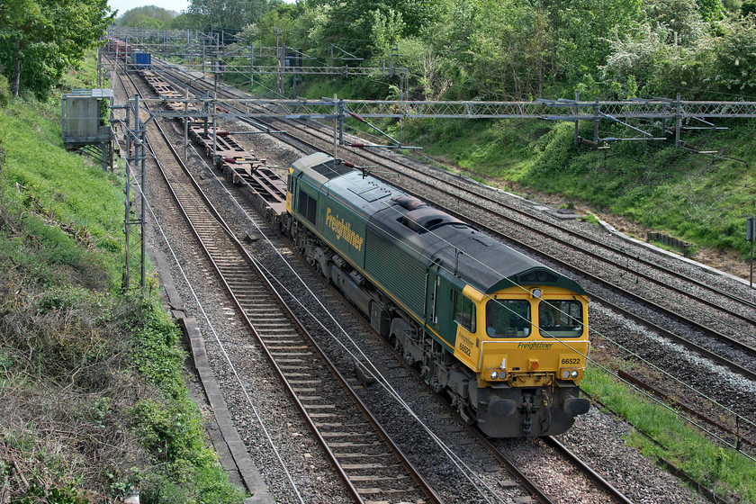 66522, 09.25 Southampton MCT-Garston (4M28, 6E), Victoria bridge 
 I have not been able to take photographs from this position on Victoria bridge near Roade for some years due to the rampant and explosive growth of ivy. However, over the previous weekend, a team had been working on the bridge to clear the ivy and undertake some survey work of the structure. I was excited that I took this image of 66522 leading the 09.25 Southampton MCT to Garston Freightliner that I took it 'wrong side' of the sun! 
 Keywords: 66522 09.25 Southampton MCT-Garston 4M28 Victoria bridge Freightliner