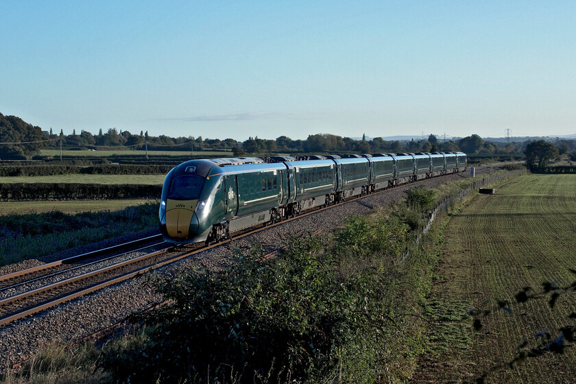 Class 80X, 07.05 London Paddington-Paignton (1C70, 1E), Berkley ST808497 
 Having left Paddington eighty minutes previously the 07.05 Paddington to Paignton 1C70 service approaches Frome near the village of Berkley. Unfortunately, I was unable to identify the number of this particular IET set as immediately to my left was a large 'phone mast and its associated buildings that blocked my view. The image is a little side lit but the early morning lighting is lovely! 
 Keywords: Class 80X 07.05 London Paddington-Paignton 1C70 Berkley ST808497 GWR IET