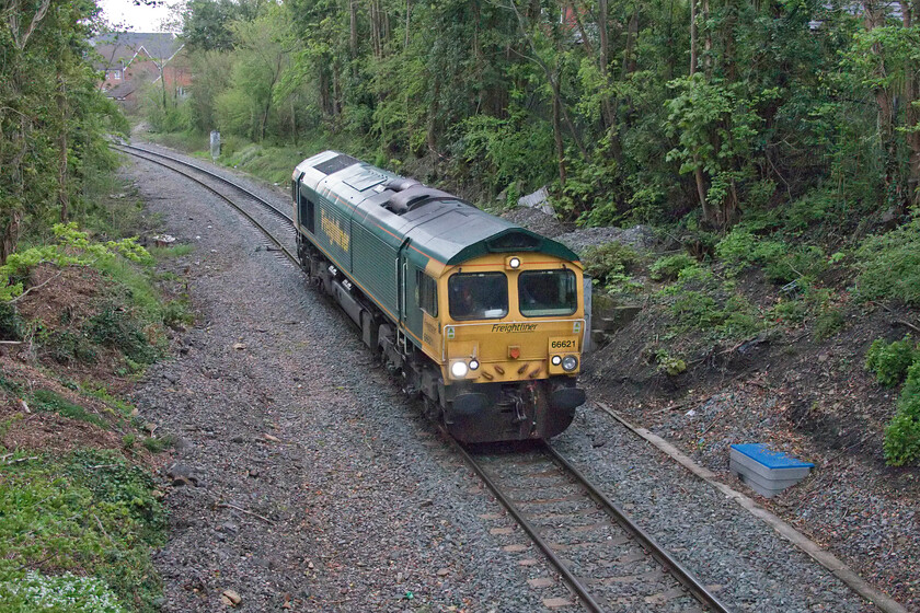 66621, 11.20 Allington-Whatley (6V18, 6E), Frome Sheppard's bridge 
 After getting back to Frome from Bath the weather picked up a little. I decided to take a walk into town from my mum's house to see this light engine movement that I had been tracking. 66621 is seen passing through Frome on the line to Whatley from the town's tiny Sheppard (sic) bridge. Running as 6V18 I believe that it had run as a light engine all the way from Allington Aggregates in the Medway valley unless anybody can advise me otherwise! 
 Keywords: 66621 11.20 Allington-Whatley 6V18, Frome Sheppard's bridge Freightliner light engine