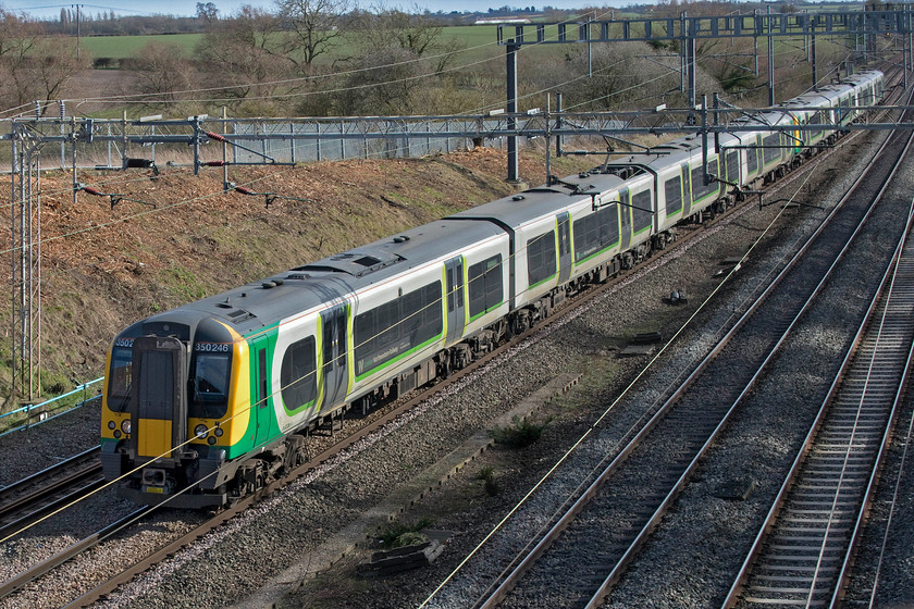 350246, LN 12.34 London Euston-Stafford (2Y48, RT), Ashton Roade bridge 
 350246 and a classmate pass Ashton Road bridge just south of Roade working the 12.34 Euston to Stafford. The embankment behind the train has been completely transformed by the recent clearance still in much evidence. This rather drastic clearance is in connection with stabilisation work that will be taking place over the coming few months that includes a number of overnight and Sunday possessions. 
 Keywords: 350246 12.34 London Euston-Stafford 2Y48 Ashton Roade bridge London Northwestern Desiro