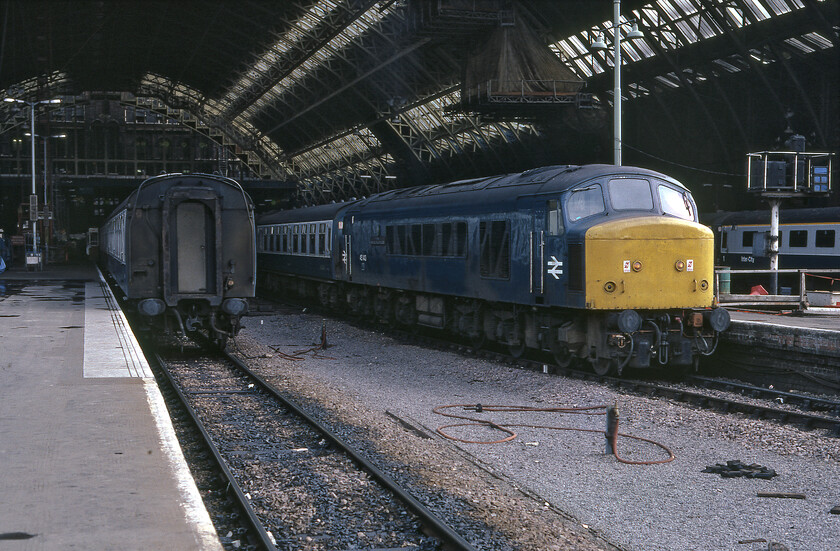 45143, 17.00 London St. Pancras-Bedford (2G17), London St. Pancras station 
 Still wearing its nameplates and crests 45143 '5th Royal Inniskilling Dragoon Guards' waits under the grand arch at St. Pancras station leading the 17.00 2G17 service to Bedford. I suspect that commuters making their way home from the capital would have appreciated travelling on this service in a 'proper' coach rather than on a rattly Class 127 DMU that were the mainstay of the stopper and local services. Having said that of course, the Class 127s were fast accelerating units that were actually one of the best incarnations of the first generation DMUs. 
 Keywords: 45143 17.00 London St. Pancras-Bedford 2G17 London St. Pancras station 5th Royal Inniskilling Dragoon Guards