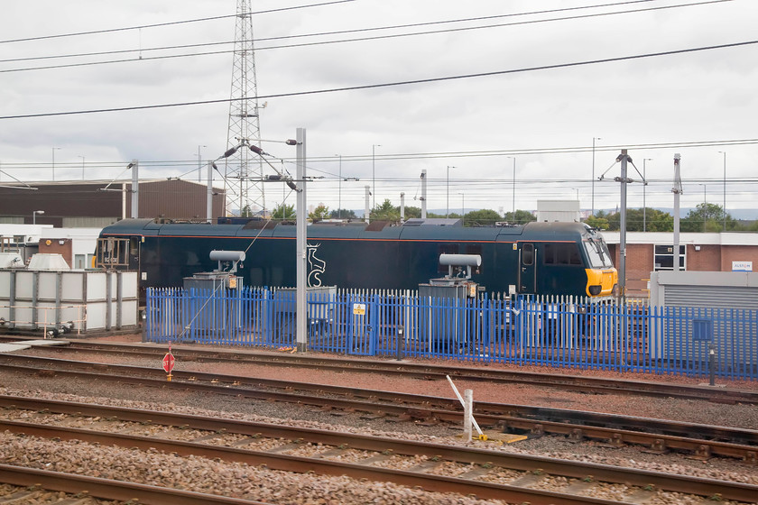 92038, stabled, Polmadie MPD 
 Caledonian Sleeper 92038 sits stabled at Polmadie Depot just south of Glasgow. This livery looks smart but appears photographically a little drab in dull lighting. It's amazing to think that these locomotives were originally designed and constructed for international freight work through the Channel Tunnel. 
 Keywords: 92038 Polmadie MPD