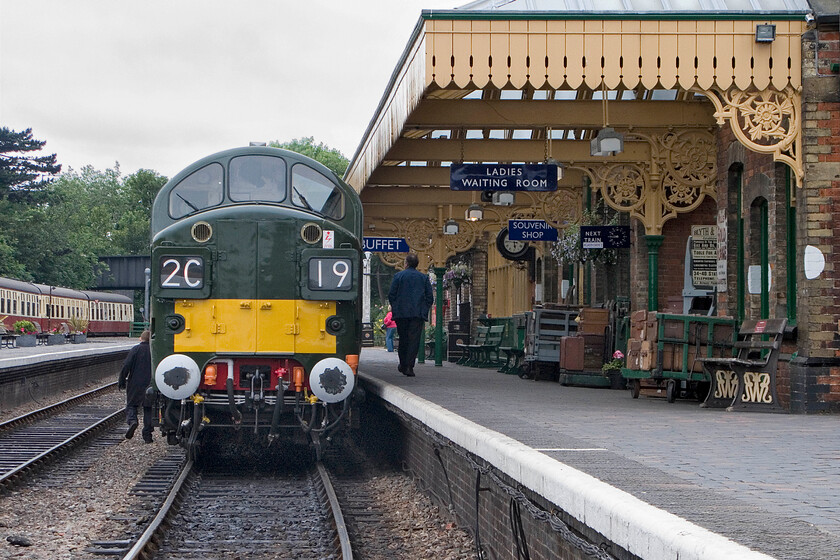 D6732, 17.30 Holt-Sheringham, Sheringham station 
 The crew walk back to the rear of D6732 (formally 37032) to un-couple it from the stock of the 17.30 Holt to Sheringham service that has just terminated at its destination. This photograph, taken from the foot crossing, reveals the superb restoration of the locomotive (with it entering service last month) and the station. The scene recreates many locations throughout East Anglia from the 1960s; very well done to all involved. 
 Keywords: D6732 17.30 Holt-Sheringham Sheringham station Type 3 Class 37 37032