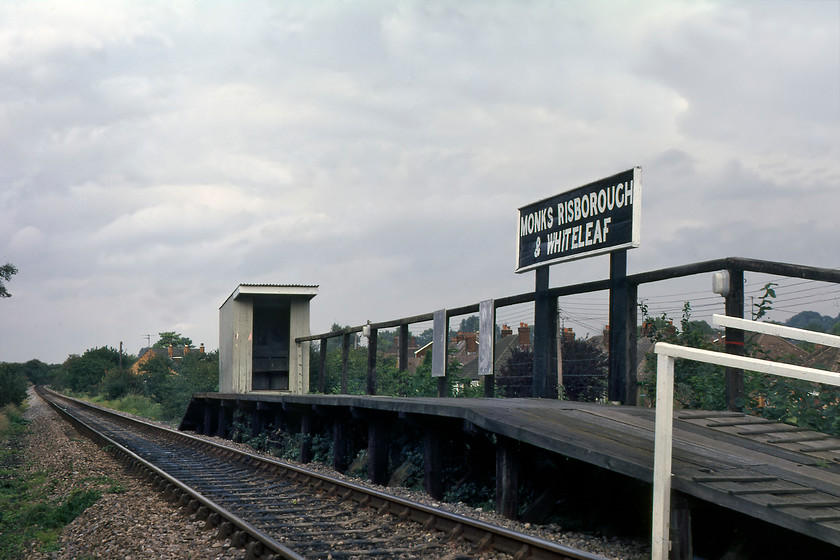 Monks Risborough & Whiteleaf halt 
 Monks Risborough and Whiteleaf halt was opened by the GWR 01.11.29 and is seen here pretty much as it had always been. I absolutely love the waiting shelter precariously mounted on the platform ramp and turned through ninety degrees. The station is still in use today on the Princes Risborough to Aylesbury line, now named just Monks Risborough. It has been extended with facilities now a little better than is seen here. Sadly, the GWR wooden running-in board is no longer present. 
 Keywords: Monks Risborough & Whiteleaf halt