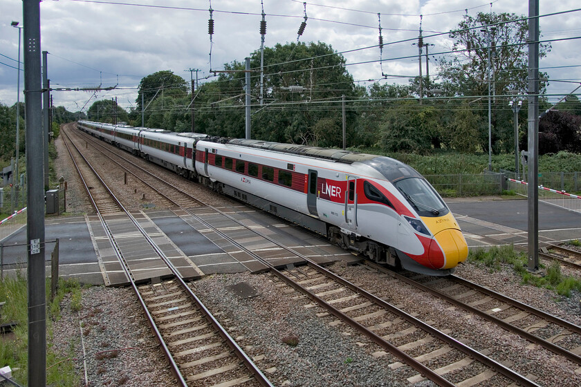 800112, GR 10.30 London King's Cross-Edinburgh Waverley (1S12, RT), Tallington 
 Another extreme wide-angled view of Tallington level crossing shows 800112 passes northbound working the 10.30 King's Cross to Edinburgh 1S12 service. This level crossing is the bain of many people's lives in this area with frequent trains (even on a strike day such as this) necetating the barriers being down for low periods causing long delays on the busy A1175 road with drivers taking a local rat run route via country lanes. 
 Keywords: 800112 10.30 London King's Cross-Edinburgh Waverley 1S12 Tallington