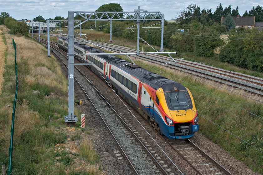 222010, EM 12.00 Sheffield-London St. Pancras (1C42, 1L), Irchester SP927667 
 222010 passes Irchester under catenary still over six months away from being energised for normal running (at the earliest). The EMR Meridian is working the 12.00 Sheffield to St. Pancras 'fast' working. This particular Meridian is instantly recognisable as having its number written in a slightly larger font and its positioning being slightly off-centre. 
 Keywords: 222010 12.00 Sheffield-London St. Pancras 1C42 Irchester SP927667 EMR East Midlands railway