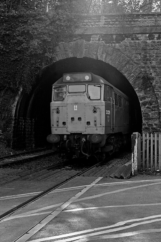 31229, unidentified Bristol Temple Meads-Portsmouth Harbour working, Bradford-on-Avon level crossing 
 With its English Electric 1,470 bhp 12SVT engine shattering the peace at Bradford-on-Avon's Greenland Mill level crossing 31229 climbs away from the town towards Bradford Junction. I did not make any notes on this particular day but this train would have been a Bristol to Portsmouth Harbour service with its next stop being Trowbridge, Wiltshire's County Town. 
 Keywords: 31229 Bristol Temple Meads-Portsmouth Harbour Bradford-on-Avon level crossing