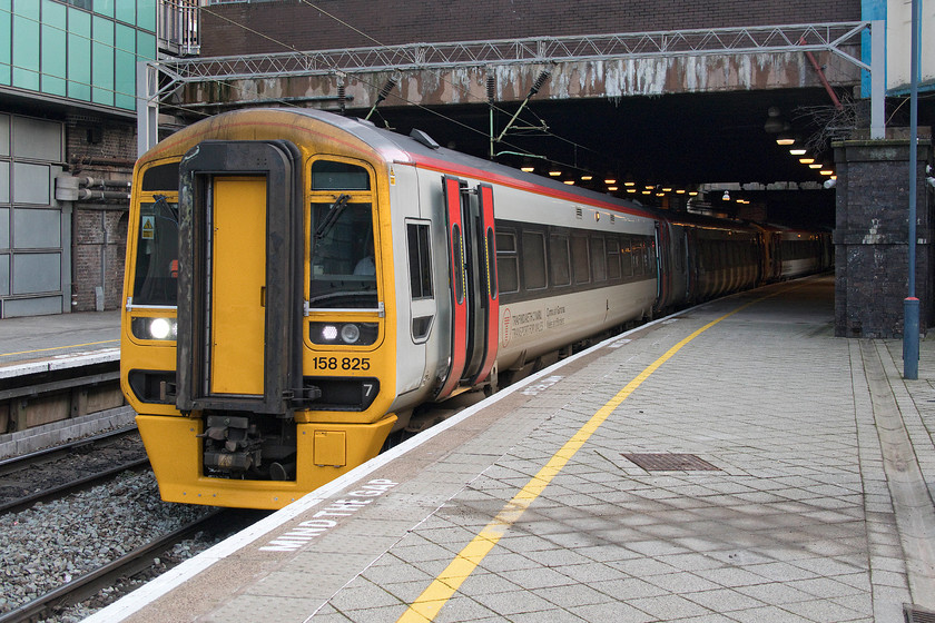 158825 & 158824, AW 11.10 Birmingham International-Holyhead (1D13, RT), Birmingham New Street station 
 158825 and 158824 pauses at Birmingham New Street station working the 11.10 Birmingham International to Holyhead service. Whilst a Class 158 is a glorified DMU, it is based around the trusted Mk. III design and so it rides well even with the intrusion from the under-frame Cummins NTA855R1engines. 
 Keywords: 158825 158824 11.10 Birmingham International-Holyhead 1D13 Birmingham New Street station Transport for Wales