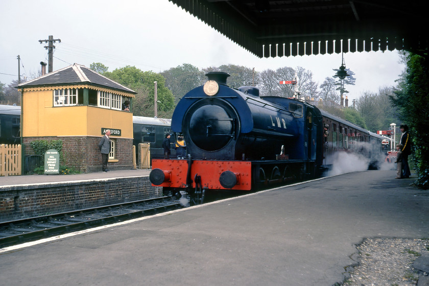 196, final Ropley-Alresford working, Alresford Station 
 The final working of the day on the Watercress Line, I believe, was an empty coaching stock run as the train was not advertised on the timetable and there was only a handful of passengers on board who appeared to be staff. 196 'Errol Lonsdale' stands at New Alresford with the stock from Ropley marking the end of the day's operation on the fledgling heritage line. Note the attractive Southern signal box on the up platform. 
 Keywords: 196, final Ropley-Alresford working, Alresford Station Errol Lonsdale Mid Hants Railway Watercress Line