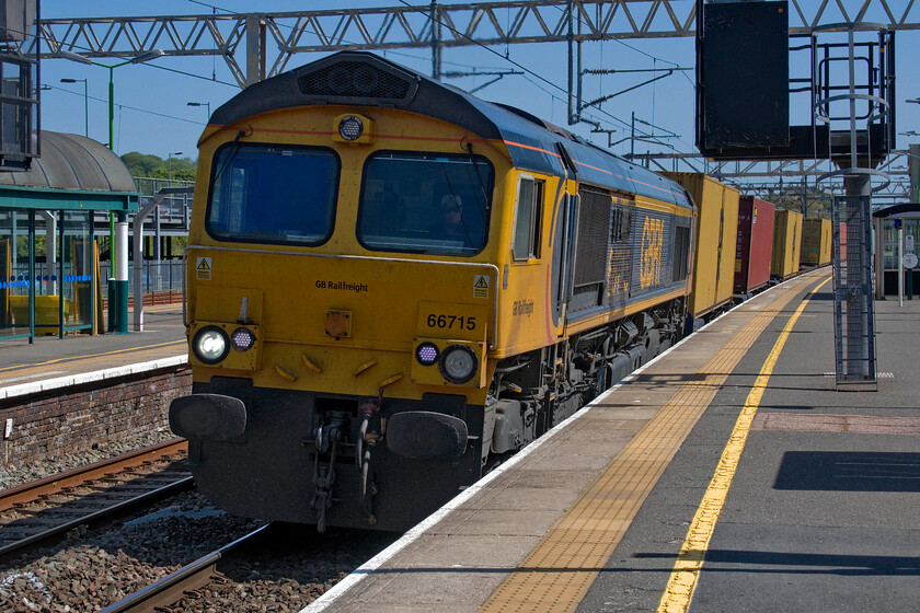 66715, 12.18 London Gateway-Hams Hall (4M47, 1L), Tring station 
 At full chat through Tring station GBRf's 66715 'Valour' leads the 12.18 London Gateway to Hams Hall 4M47 service. Even though I am clearly on the right side of the yellow line the disturbance of air as the train passed at speed was considerable even knocking over Andy's drink that was placed on the platform against the railings someway further to the right. This was the second time that this had happened losing his ice from an empty cup when an earlier train had passed! 
 Keywords: 66715 12.18 London Gateway-Hams Hall 4M47 Tring station