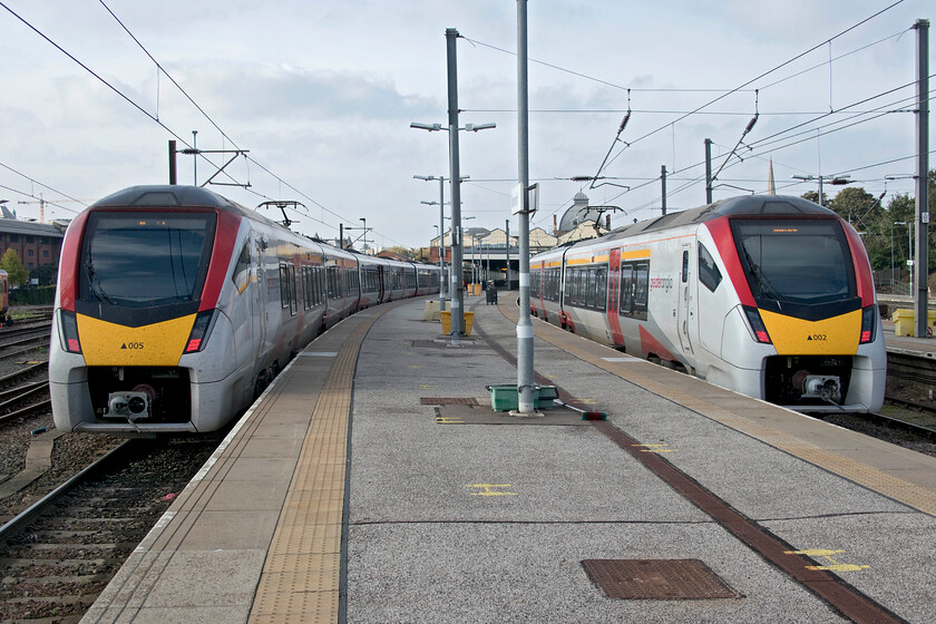 745005, GA 14.30 Norwich-London Liverpool Street (1P45, RT) & 745002, GA 12.30 London Liverpool Street-Norwich (1P28, RT), Norwich station 
 At Norwich station 745005 to the left will work the 14.30 1P45 service to Liverpool Street whilst 745002 has recently arrived with the 12.30 from London. The latter will work the 15.00 return service to the capital once a body of staff has cleaned and serviced the train in the intervening forty-five minutes or so. 
 Keywords: 745005 14.30 Norwich-London Liverpool Street 1P45 745002 12.30 London Liverpool Street-Norwich 1P28 Norwich station GA Greater Anglia Stadler FLIRT