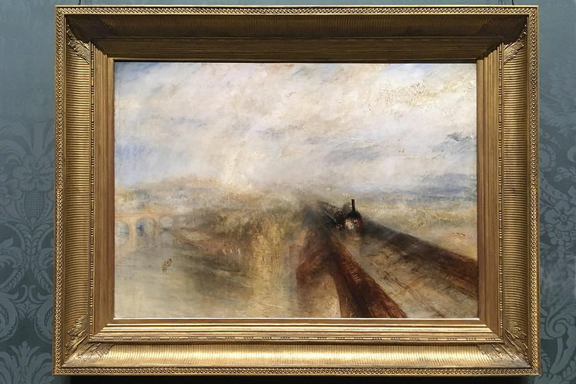 Rain, Steam & Speed, JMW Turner (1844), National Gallery 
 One of the finest legacies of Tony Blair's government under the care of his culture secretary Chris Smith was the making of a number of galleries free to enter. The National Gallery is one of the recipients of this policy and what a place to visit for no charge whatsoever. My wife and I took advantage of the recently introduced late opening on Fridays with far fewer visitors thus meaning far better access to the fine works of art on display. One of my favourite artists is JMW Turner (1775-1851) who was born a stone's throw from the gallery in Covent Garden. His work was characterised by (according to Wikipedia) 'expressive colourisations, imaginative landscapes and turbulent, often violent marine paintings'. One of his most famous paintings is this one titled 'Rain, Steam & Speed' dating from 1844. It shows a broad-gauge Great Western locomotive heading west over what is widely accepted as Maidenhead Railway bridge, that crosses the River Thames between Taplow and Maidenhead. 
 Keywords: Rain, Steam & Speed, JMW Turner 1844 National Gallery