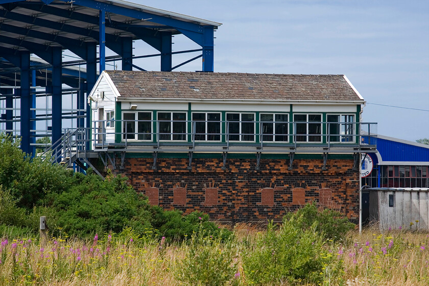 Workington Main No. 2 signal box (LNW, 1889) 
 Workington Main No. 3 signal box is a LNWR Type 4 box has 58 levers but many are now painted white and out of use with the closure of the once prolific number of sidings and the depot. The grand box dates from 1889 and is now inaccessible for a close-up photograph. The balcony is an unusual addition and looks as though it was replaced with a galvanised version when the steps were updated. 
 Keywords: Workington Main No. 2 signal box LNW, 1889