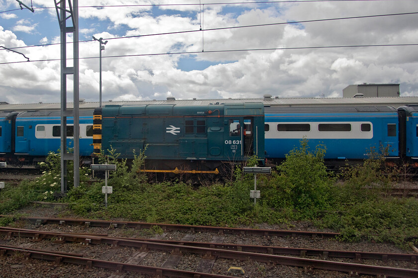 08631, shunting & M40802, stabled, LSL Crewe 
 LSL's facility on the approach to Crewe station is now packed with a variety of interesting trains and stock. As 08631 trundles about its business, a former HST Mk3 Trailer Buffet is seen behind.M40802 is a Trailer Buffet that now wears its Pullman paint scheme as part of one of LSL's dedicated HST sets that are proving popular with charter operators up and down the country. 
 Keywords: 08631 shunting M40802 stabled LSL Crewe Locomotive Services Limited HST Mk. III Mk3 Trailer Buffet