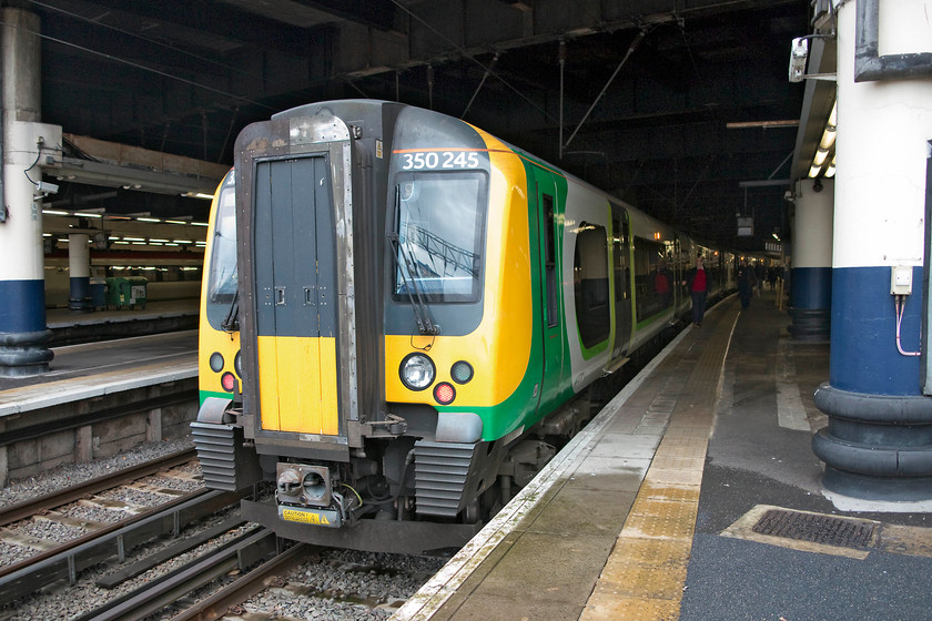 350245, LN 14.54 London Euston-Northampton (2N19, RT), London Euston station 
 Just poking its head out from the gloom of London Euston station, 350245 waits forming the 14.54 to Birmingham New Street. My wife and I took this 2N19 working back to Northampton. 
 Keywords: 350245 2N19 London Euston station