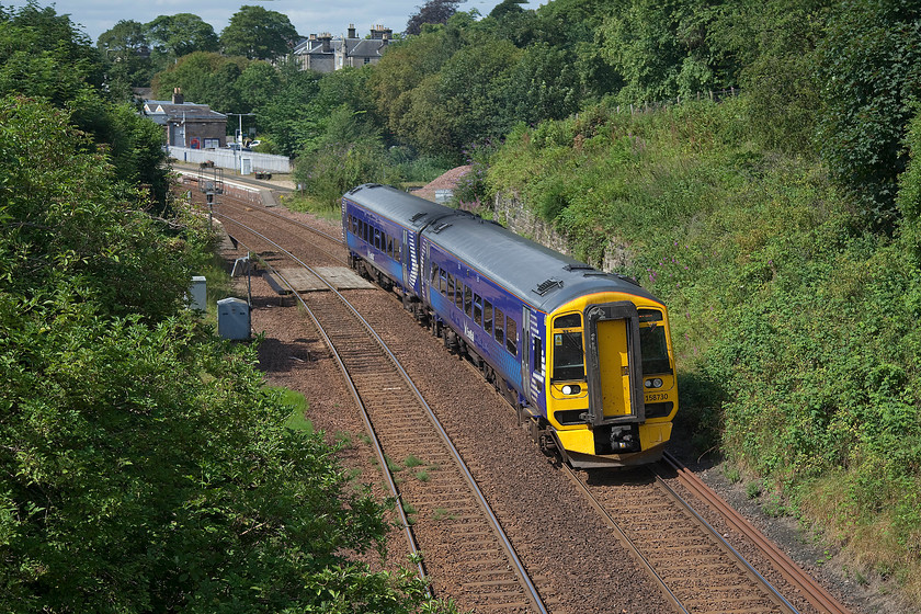 158730, SR 11.15 Edinburgh W-Cowdenbeath (2G25, 1E), Dunfermline Park, Public Road bridge 
 With Dumfermline station in the background, 158730 leaves with the 11.15 Edinburgh Waverley to Cowdenbeath service. I am standing on a bridge in Dunfermline park, a very pleasant place to be on a summer's day taking pictures of trains. I was also able to enjoy eating some superb wild raspberries that were growing by the bridge! 
 Keywords: 158730 11.15 Edinburgh W-Cowdenbeath 2G25 Dunfermline Park Public Road bridge