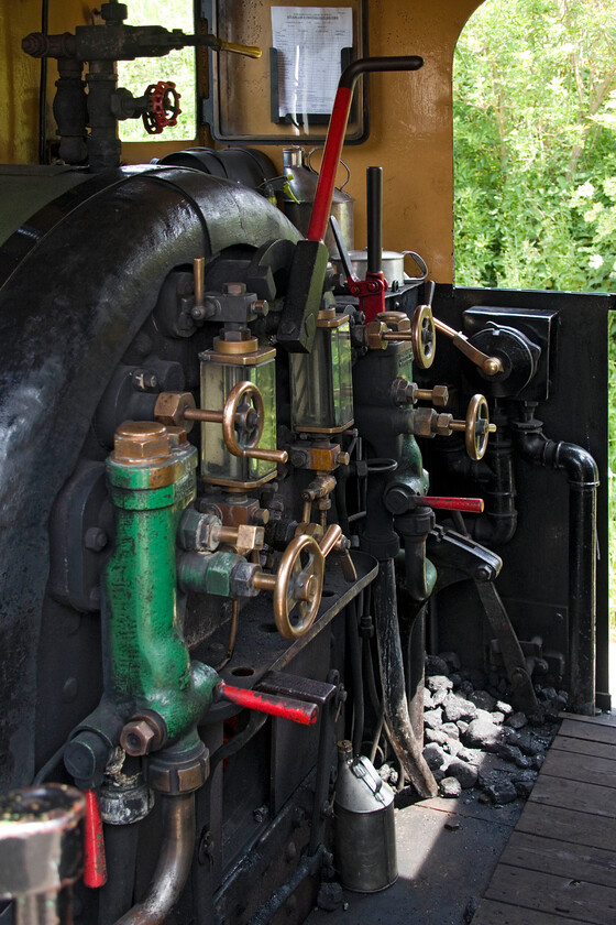 Footplate, No. 4, 12.00 Pitsford return 
 A final look at the footplate of Peckett No.4 (formally 2104) at Pitsford and Brampton station. The footplate experience was enjoyable with the main thing that I'll take from it was the young and enthusiastic driver and fireman that gives real hope for the heritage scene; well done and thanks to them! 
 Keywords: Footplate No. 4 12.00 Pitsford return 2104 peckett 0-2- st