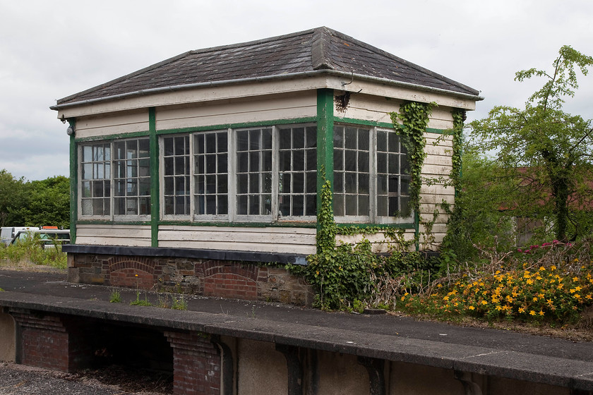 Bere Alston signal box (derelict) (LSW, c.1890) 
 The former Bere Alston signal box stands on the disused platform at the station that is still open. This station was once on the L & SW mainline route that linked London to Plymouth (and beyond) but that went inland from Exeter rather than via Brunel's troubled coastal route. There is constant talk of this line being reopened to avoid further issues with the coastal route. Notice the swarm of bees that had taken up residence on the end of the signal box just above the window. 
 Keywords: Bere Alston signal box